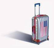 白色上孤立着美国国旗的现代手提箱