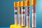 2019冠状病毒病医用试管，悬挂法国、英国、西班牙、美国和意大利国旗