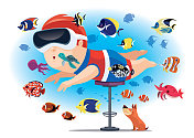 带着VR模拟器和热带鱼一起游泳的孩子
