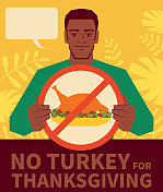 感恩节没有火鸡;英俊的男人举着禁止吃火鸡肉的牌子