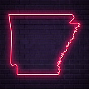 阿肯色州地图-砖墙背景上发光的霓虹灯 阿肯色州地图-砖墙背景上发光的霓虹灯
