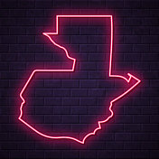 危地马拉地图-砖墙背景上发光的霓虹灯 危地马拉地图-砖墙背景上发光的霓虹灯