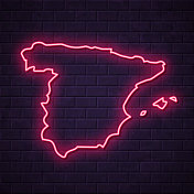西班牙地图-发光的霓虹灯在砖墙的背景 西班牙地图-发光的霓虹灯在砖墙的背景