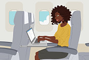 坐飞机旅行的黑人商务女性