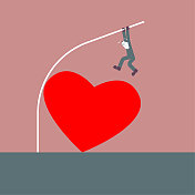 撑杆跳高时，一个男人穿过心形标志。