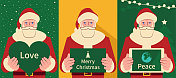 快乐的圣诞老人手持圣诞贺卡和心形标志和数字平板电脑