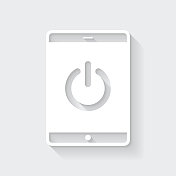 带电源按钮的平板电脑。图标与空白背景上的长阴影-平面设计