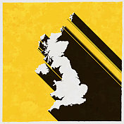 在纹理黄色背景上有长阴影的英国地图