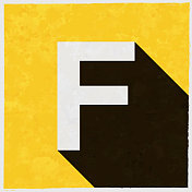 字母f图标与长阴影的纹理黄色背景