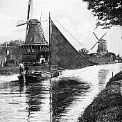 19世纪荷兰乡间的运河上，人们在风车旁航行