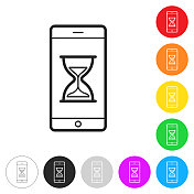智能手机与沙漏。彩色按钮上的图标 智能手机与沙漏。彩色按钮上的图标