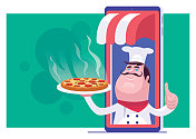 快乐的厨师拿着披萨在手机上