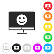 台式电脑上有快乐的表情。彩色按钮上的图标
