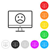 台式电脑上有悲伤的表情。彩色按钮上的图标