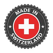瑞士制造的徽章向量。贴纸上有星星和国旗。标志孤立在白色背景上。