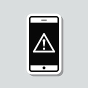 带有危险警告注意的智能手机。图标贴纸在灰色背景