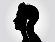 男人戴着耳机听音乐的肖像。 男人戴着耳机听音乐的肖像。