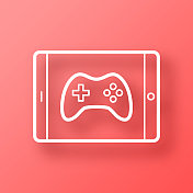 平板电脑上的视频游戏。图标在红色背景与阴影