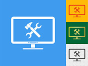 电脑屏幕与扳手和锤子图标设置。