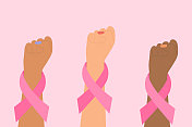乳腺癌意识概念。女性双手举起系着粉色丝带的拳头