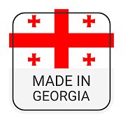 制造在格鲁吉亚徽章矢量。有星星和国旗的贴纸。标志孤立在白色背景上。
