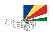 塞舌尔垃圾邮票。复古明信片矢量插图与塞舌尔国旗孤立的白色背景。复古的风格。