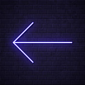 左箭头。在砖墙背景上发光的霓虹灯图标
