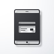 带信用卡的平板电脑。白色背景上的阴影图标