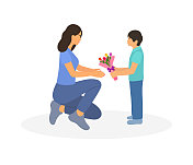 小男孩给妈妈一束花。庆祝母亲节或生日