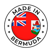 在百慕大制造-矢量图形。圆形简易标签徽章，图案为百慕大国旗，文字为百慕大制造。白底隔离