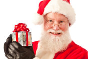 圣诞老人与圣诞现金钱礼物在白色的背景