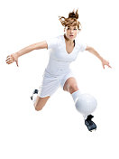 女足球运动员带着足球奔跑