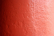 粉橙色油漆墙抽象背景